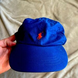 Blue Ralph Lauren strap back hat with orange pony